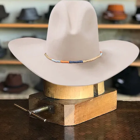 Classic White Cowboy Hat with Wide Crown and Downturned Brim