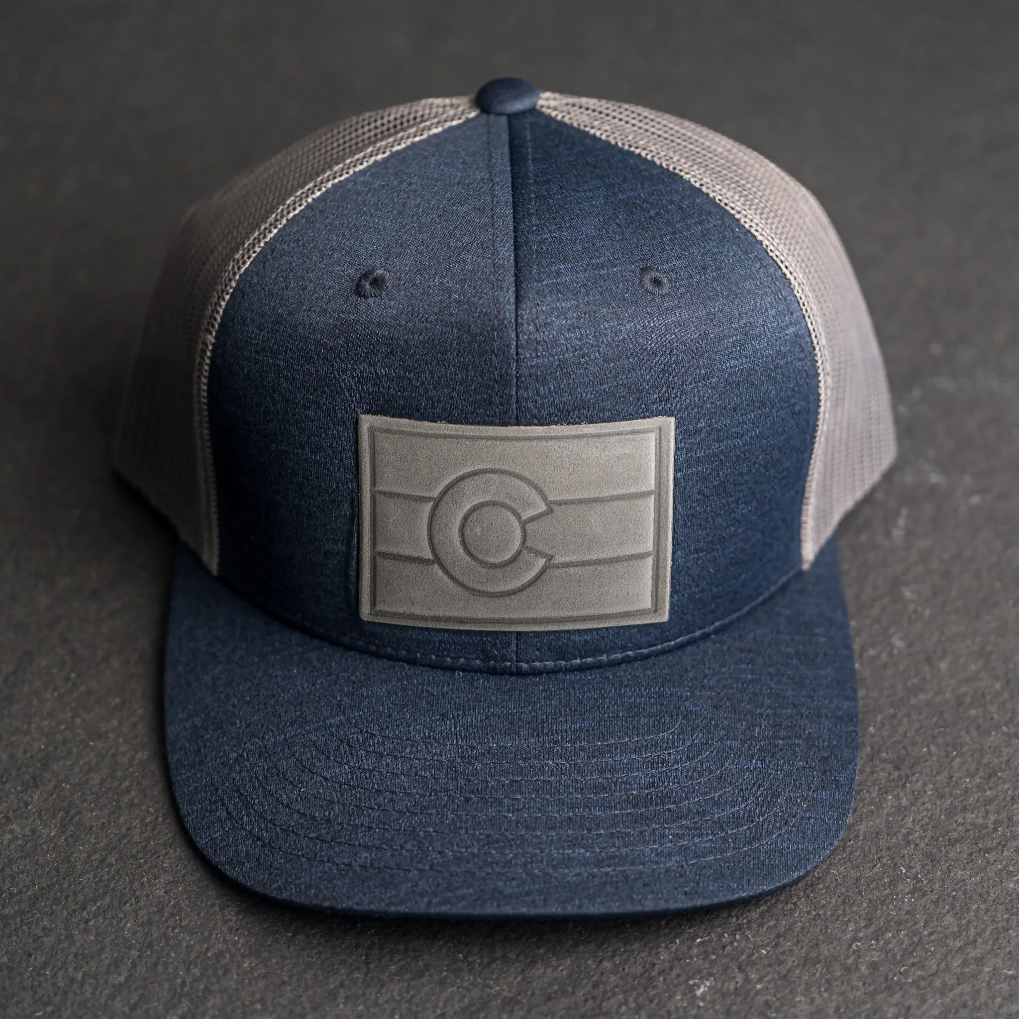 Leather Patch Performance Style Trucker Hat - Colorado Flag Stamp