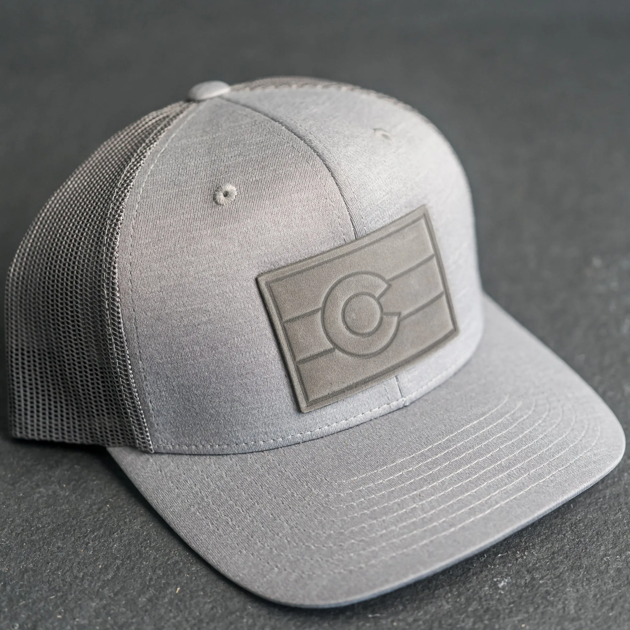 Leather Patch Performance Style Trucker Hat - Colorado Flag Stamp