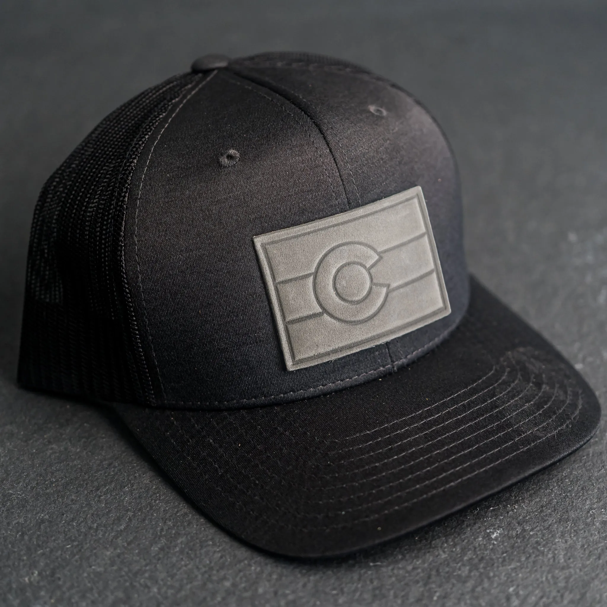 Leather Patch Performance Style Trucker Hat - Colorado Flag Stamp