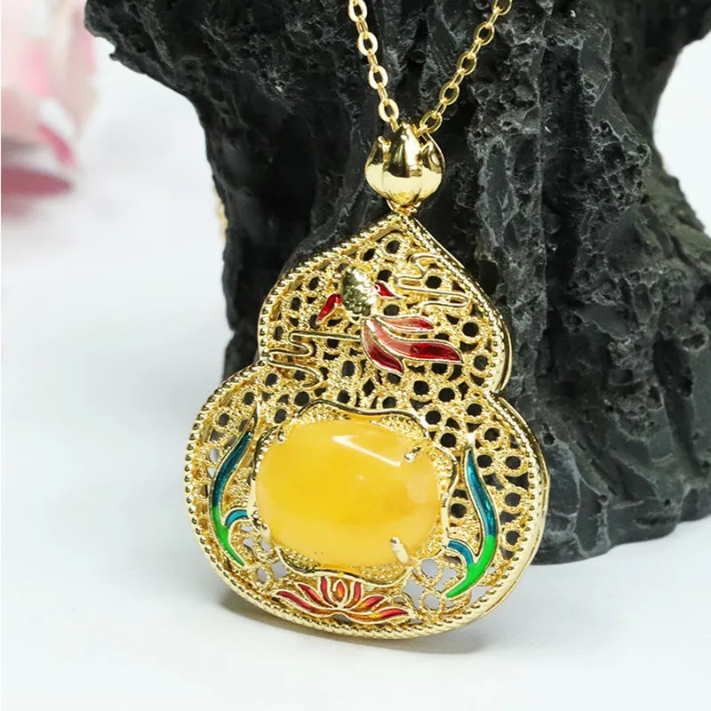 Lotus Leaf Fish Gourd Pendant Necklace crafted in Beeswax Amber and Sterling Silver