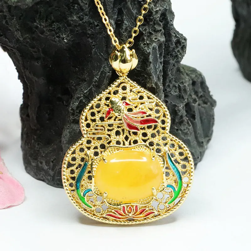 Lotus Leaf Fish Gourd Pendant Necklace crafted in Beeswax Amber and Sterling Silver