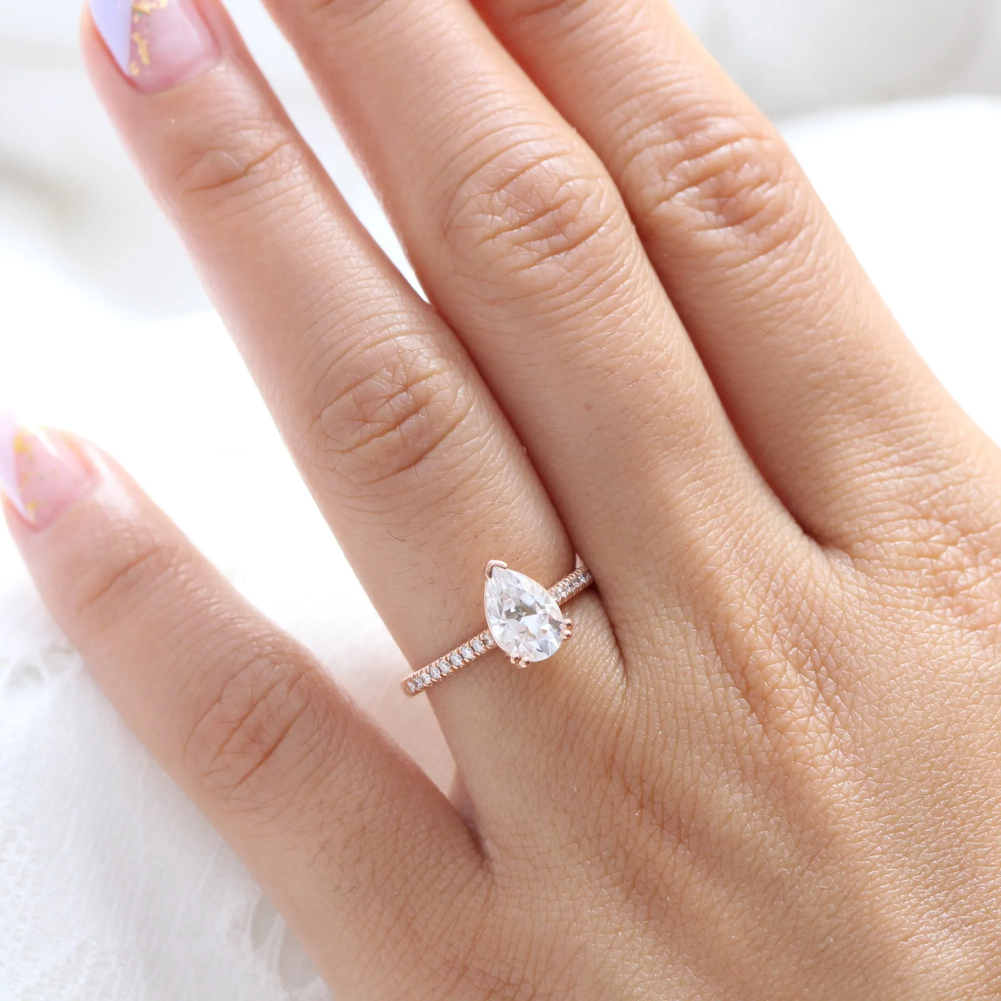 Pear Moissanite Engagement Ring in Grace Solitaire Pave Diamond Band