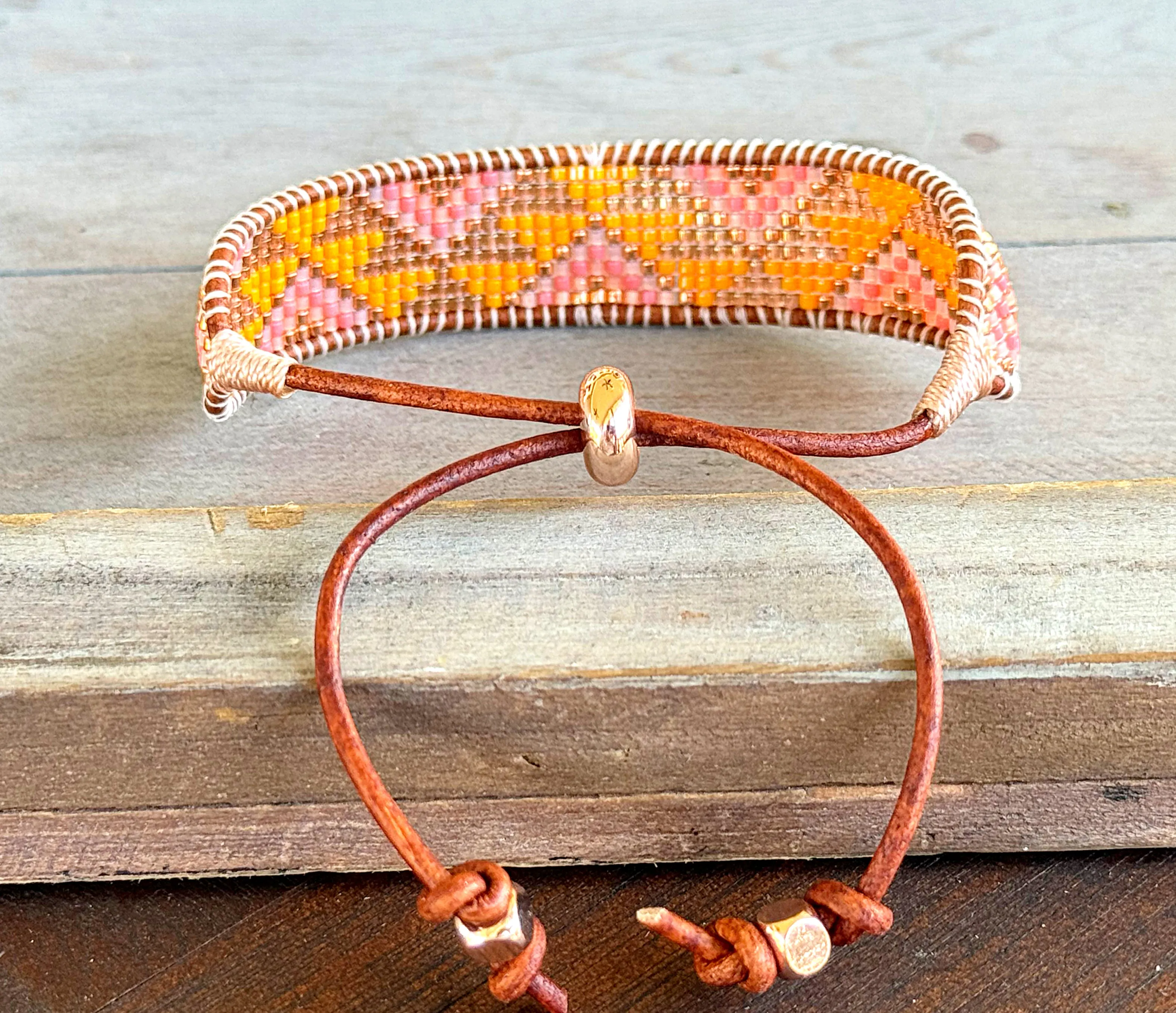 Sunshine, Peach Fuzz, and Coral Loom woven western beaded friendship bracelet